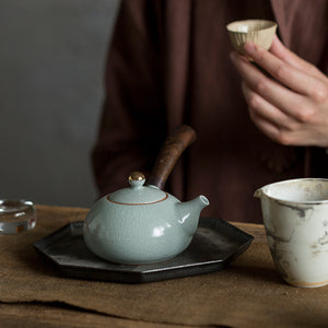 Ceramic teapot with wooden handle